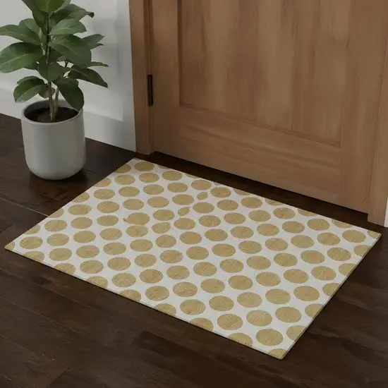 Gold And Ivory Polka Dot Washable Area Rug With UV Protection Photo 1