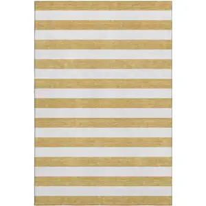 Photo of Gold And Ivory Striped Washable Area Rug With UV Protection
