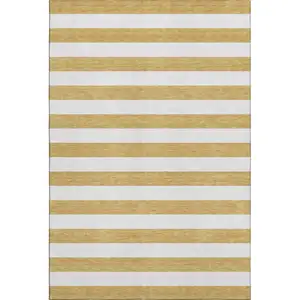 Photo of Gold And Ivory Striped Washable Area Rug With UV Protection