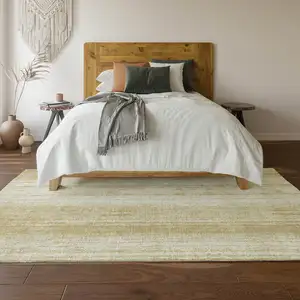 Photo of Gold And Ivory Striped Washable Area Rug With UV Protection