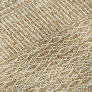 Photo of Gold And Ivory Striped Washable Area Rug With UV Protection