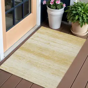 Photo of Gold And Ivory Striped Washable Indoor Outdoor Area Rug