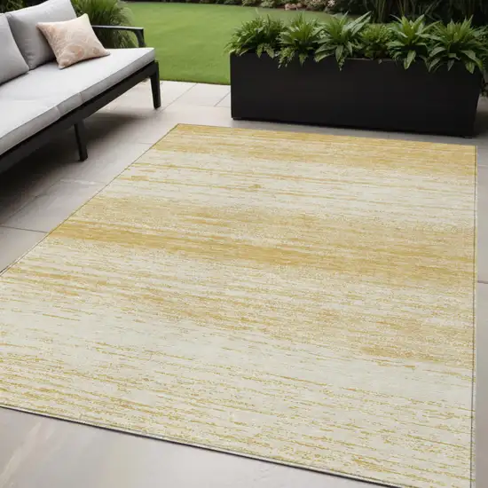 Gold And Ivory Striped Washable Indoor Outdoor Area Rug Photo 1