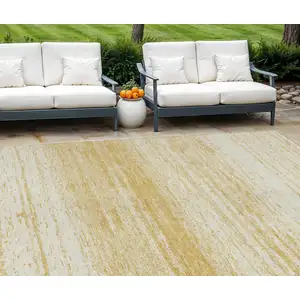 Photo of Gold And Ivory Striped Washable Indoor Outdoor Area Rug