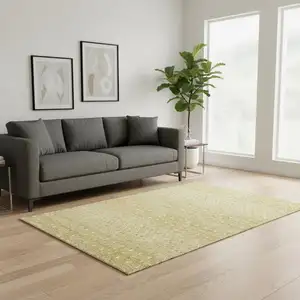 Photo of Gold And Ivory Tribal Washable Area Rug With UV Protection