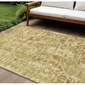 Photo of Gold And Ivory Tribal Washable Indoor Outdoor Area Rug