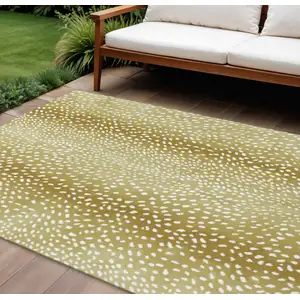 Photo of Gold And White Animal Print Washable Indoor Outdoor Area Rug
