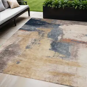 Photo of Gold Beige And Blue Abstract Washable Indoor Outdoor Area Rug