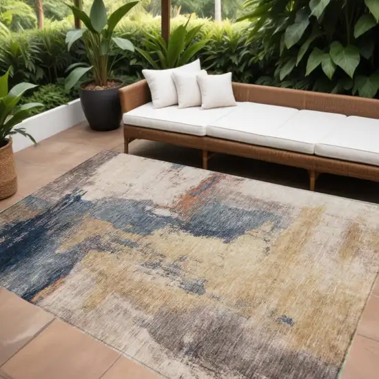 Gold Beige And Blue Abstract Washable Indoor Outdoor Area Rug Photo 1