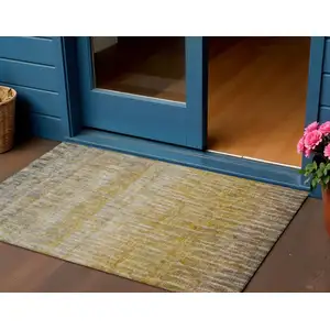 Photo of Gold Beige And Gray Abstract Washable Indoor Outdoor Area Rug