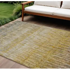 Photo of Gold Beige And Gray Abstract Washable Indoor Outdoor Area Rug
