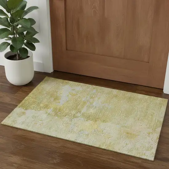 Gold Beige And Ivory Abstract Washable Area Rug With UV Protection Photo 1