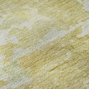 Photo of Gold Beige And Ivory Abstract Washable Area Rug With UV Protection