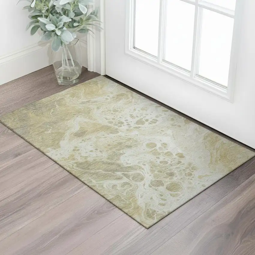 Gold Beige And Ivory Abstract Washable Area Rug With UV Protection Photo 2