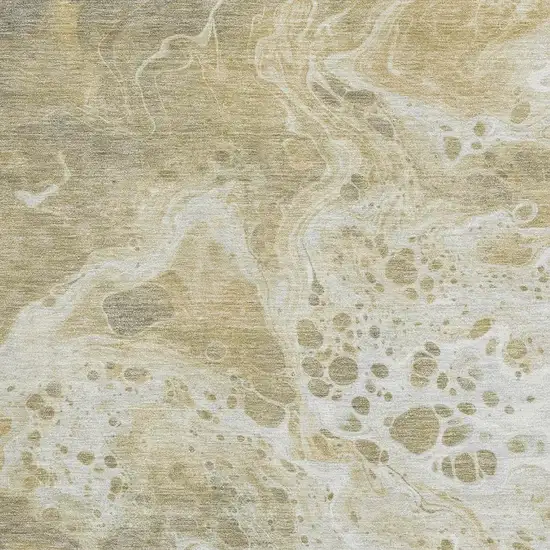 Gold Beige And Ivory Abstract Washable Area Rug With UV Protection Photo 2