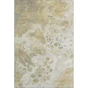Photo of Gold Beige And Ivory Abstract Washable Area Rug With UV Protection