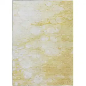 Photo of Gold Beige And Ivory Abstract Washable Indoor Outdoor Area Rug