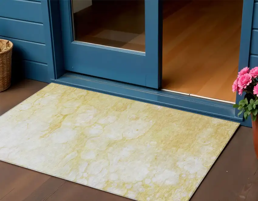 Gold Beige And Ivory Abstract Washable Indoor Outdoor Area Rug Photo 1