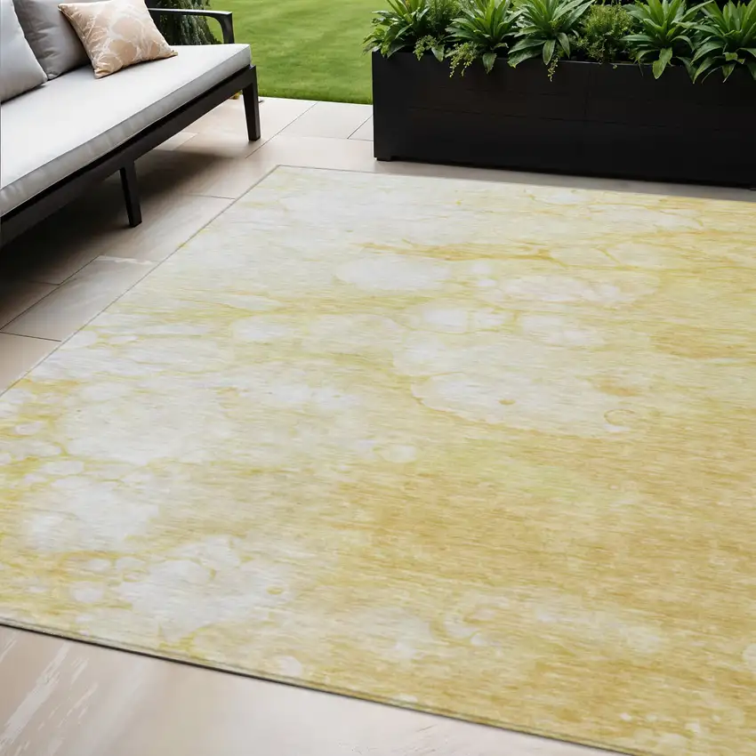 Gold Beige And Ivory Abstract Washable Indoor Outdoor Area Rug Photo 1