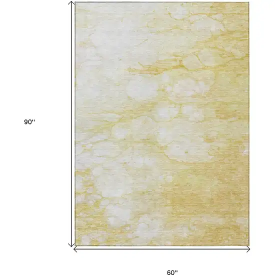 Gold Beige And Ivory Abstract Washable Indoor Outdoor Area Rug Photo 9