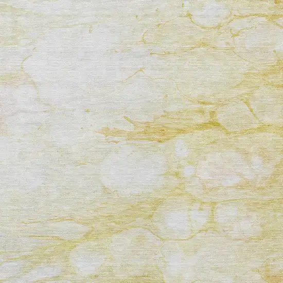 Gold Beige And Ivory Abstract Washable Indoor Outdoor Area Rug Photo 4