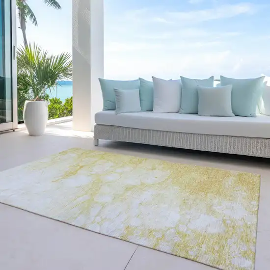 Gold Beige And Ivory Abstract Washable Indoor Outdoor Area Rug Photo 9
