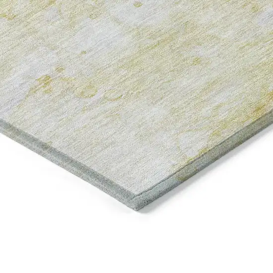 Gold Beige And Ivory Abstract Washable Indoor Outdoor Area Rug Photo 3