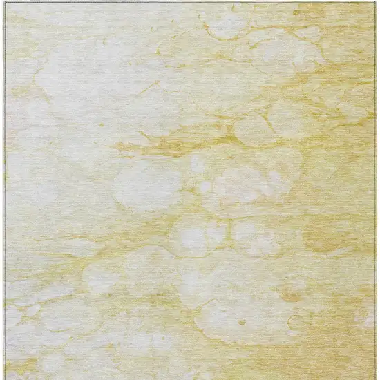 Gold Beige And Ivory Abstract Washable Indoor Outdoor Area Rug Photo 5