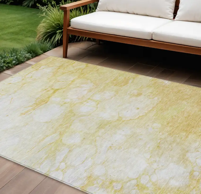 Gold Beige And Ivory Abstract Washable Indoor Outdoor Area Rug Photo 1