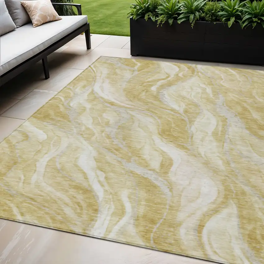 Gold Beige And Ivory Abstract Washable Indoor Outdoor Area Rug Photo 1