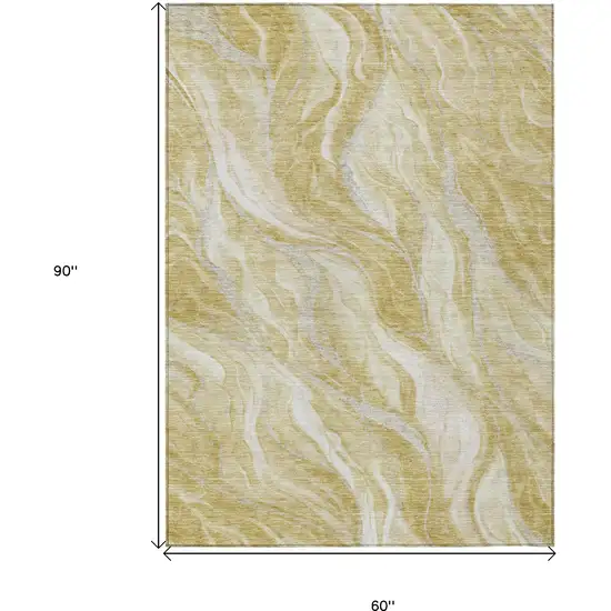 Gold Beige And Ivory Abstract Washable Indoor Outdoor Area Rug Photo 3