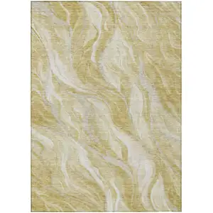 Photo of Gold Beige And Ivory Abstract Washable Indoor Outdoor Area Rug