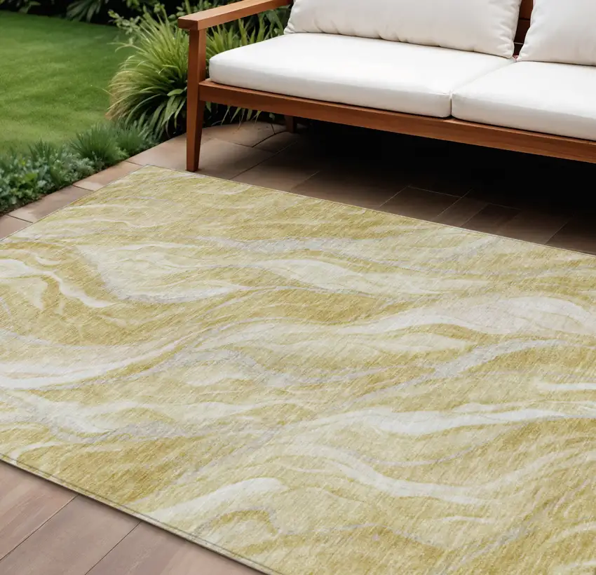 Gold Beige And Ivory Abstract Washable Indoor Outdoor Area Rug Photo 1
