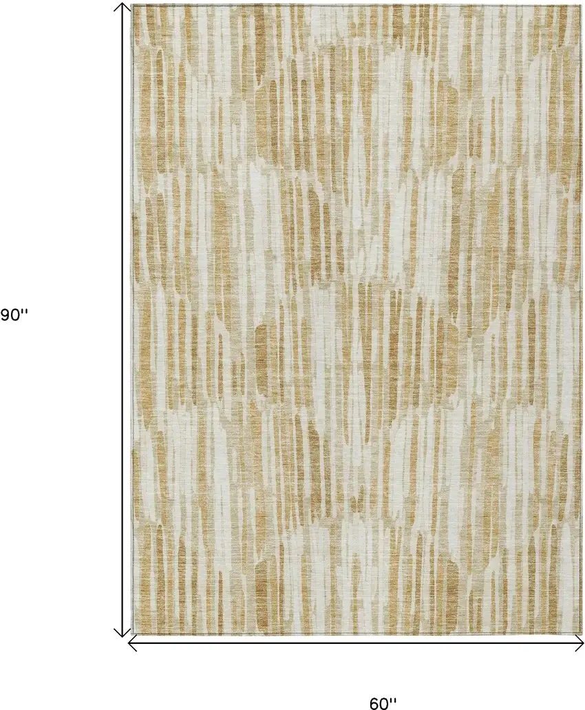 Gold Beige And Ivory Abstract Washable Indoor Outdoor Area Rug Photo 3