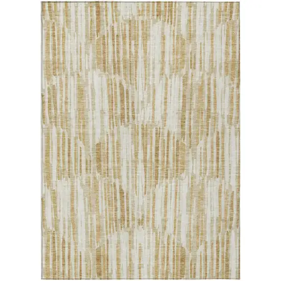 Gold Beige And Ivory Abstract Washable Indoor Outdoor Area Rug Photo 1