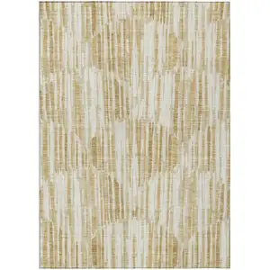 Photo of Gold Beige And Ivory Abstract Washable Indoor Outdoor Area Rug
