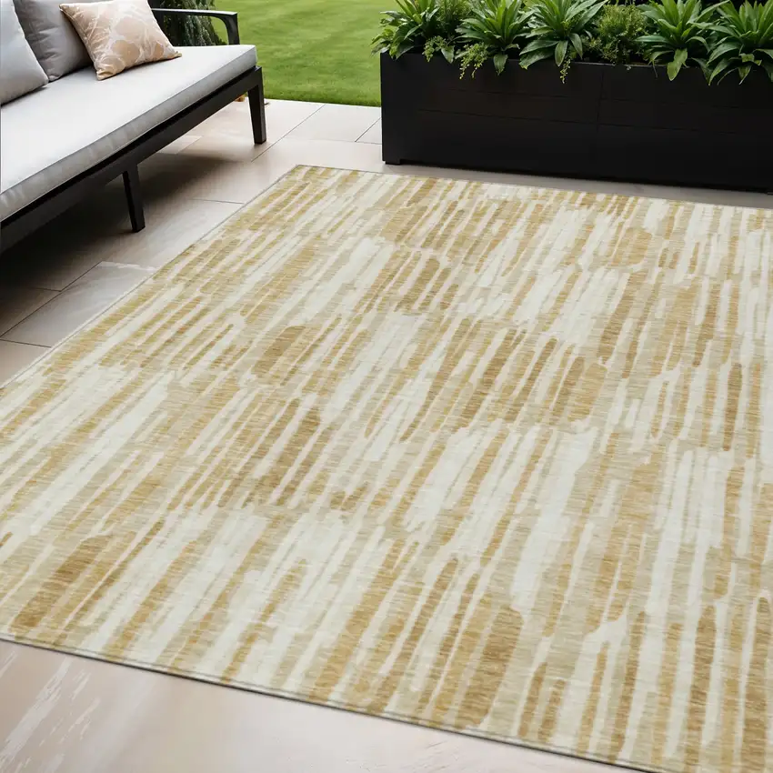 Gold Beige And Ivory Abstract Washable Indoor Outdoor Area Rug Photo 1