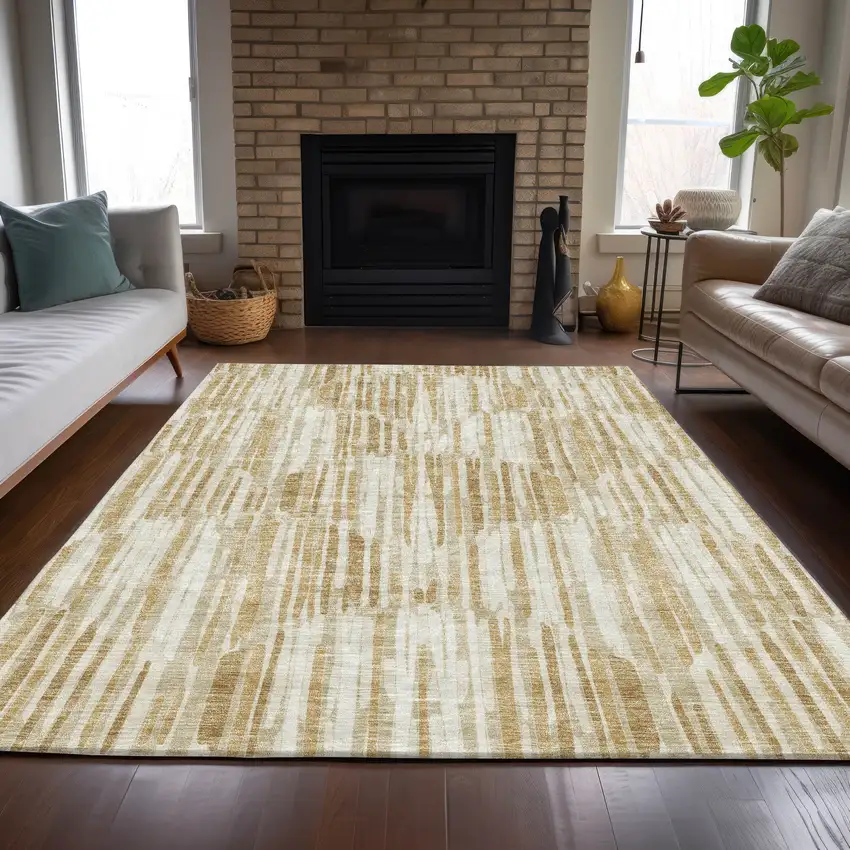 Gold Beige And Ivory Abstract Washable Indoor Outdoor Area Rug Photo 7
