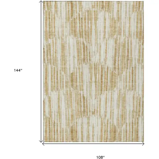 Gold Beige And Ivory Abstract Washable Indoor Outdoor Area Rug Photo 1