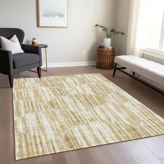 Gold Beige And Ivory Abstract Washable Indoor Outdoor Area Rug Photo 8
