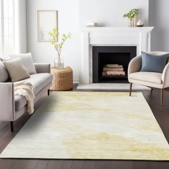 Gold Beige And Ivory Abstract Washable Indoor Outdoor Area Rug Photo 8