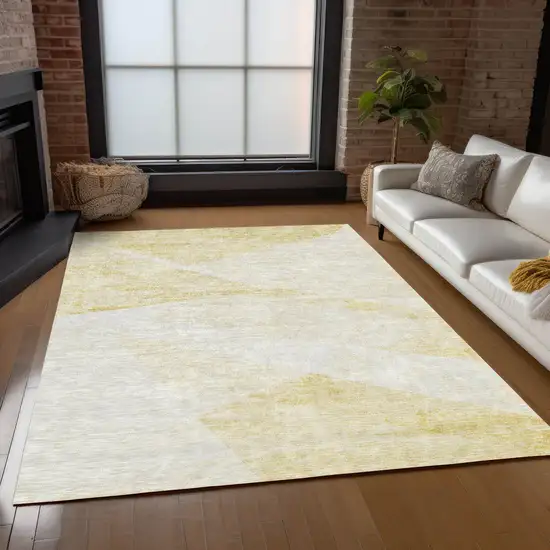 Gold Beige And Ivory Abstract Washable Indoor Outdoor Area Rug Photo 9