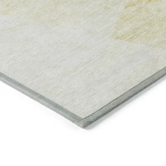 Gold Beige And Ivory Abstract Washable Indoor Outdoor Area Rug Photo 3