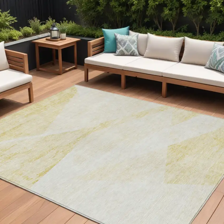 Gold Beige And Ivory Abstract Washable Indoor Outdoor Area Rug Photo 1