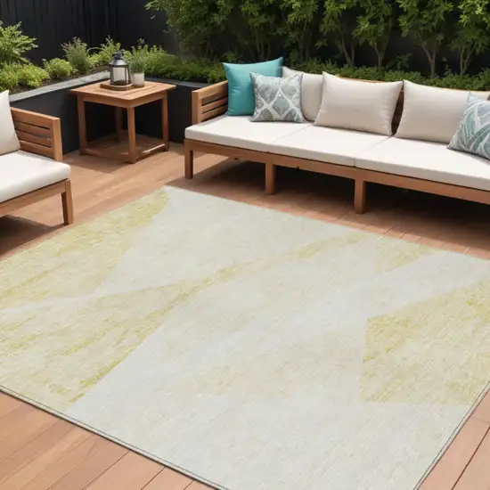 Gold Beige And Ivory Abstract Washable Indoor Outdoor Area Rug Photo 1