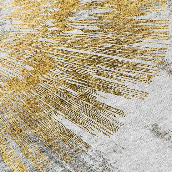 Gold Beige And Ivory Abstract Washable Indoor Outdoor Area Rug Photo 5