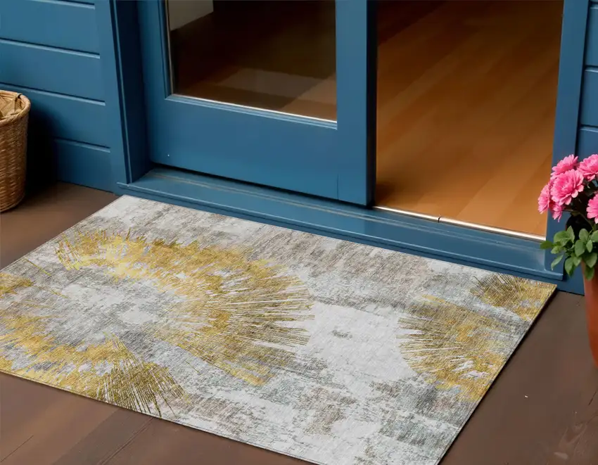 Gold Beige And Ivory Abstract Washable Indoor Outdoor Area Rug Photo 1
