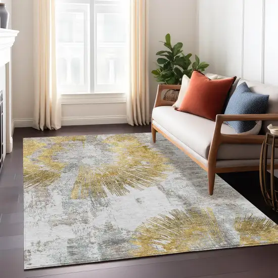 Gold Beige And Ivory Abstract Washable Indoor Outdoor Area Rug Photo 9