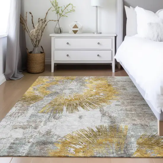 Gold Beige And Ivory Abstract Washable Indoor Outdoor Area Rug Photo 9