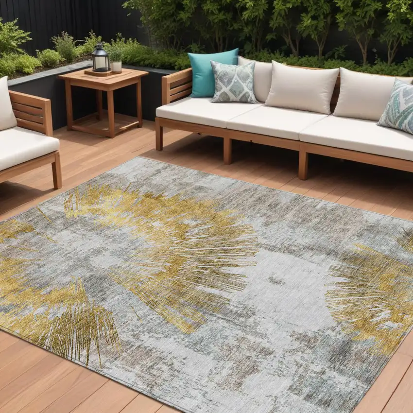 Gold Beige And Ivory Abstract Washable Indoor Outdoor Area Rug Photo 1